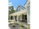 A charming front porch with white columns and stone accents at 22 Stratford Way, Kingston, GA 30145