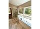 Bathroom with soaking tub, walk-in shower and view to backyard at 22 Stratford Way, Kingston, GA 30145