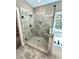 Large walk-in shower with glass enclosure and built-in seat at 22 Stratford Way, Kingston, GA 30145