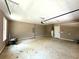 Two-car garage with additional storage and a water heater at 22 Stratford Way, Kingston, GA 30145