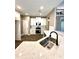 Modern kitchen with white cabinets, quartz countertops and black faucet at 22 Stratford Way, Kingston, GA 30145
