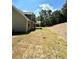 Two-story house with gray siding, stone accents, and a covered patio at 22 Stratford Way, Kingston, GA 30145