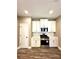 Modern kitchen with white cabinets, stainless steel appliances, and quartz countertops at 22 Stratford Way, Kingston, GA 30145
