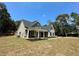 Two-story house with gray siding, stone accents, and a front porch at 22 Stratford Way, Kingston, GA 30145
