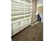 Built-in white bookshelves and cabinets offer ample storage at 22 Stratford Way, Kingston, GA 30145