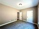 Simple bedroom with carpet and neutral walls at 22 Stratford Way, Kingston, GA 30145