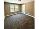 Bright bedroom featuring carpet flooring and large window at 22 Stratford Way, Kingston, GA 30145