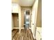 Bright hallway with wood-look flooring leading to other rooms at 22 Stratford Way, Kingston, GA 30145