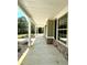 Inviting front porch with stone accents and white columns at 22 Stratford Way, Kingston, GA 30145