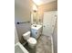 Bathroom with white vanity, toilet, and tile floor at 22 Stratford Way, Kingston, GA 30145