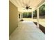 Covered back porch with ceiling fan and view of backyard at 22 Stratford Way, Kingston, GA 30145