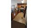 Galley kitchen with wood cabinets and tile floor at 930 Parkway Rd, Union City, GA 30291