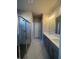 Double vanity bathroom with a large shower at 360 Lakeside Ct, Canton, GA 30114