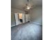 Main bedroom with carpet and access to bathroom at 360 Lakeside Ct, Canton, GA 30114