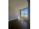 Bright bedroom with hardwood floors and large window at 360 Lakeside Ct, Canton, GA 30114