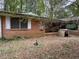 Brick house with mature trees and landscaping at 2364 El Paso Sw Rd, Atlanta, GA 30331
