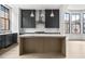 Kitchen island with light wood finish and marble countertop, stainless steel appliances at 110 Sheridan Ne Dr, Atlanta, GA 30305