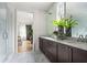 Bathroom with double vanity and marble countertops, plus a view into the bedroom at 110 Sheridan Ne Dr, Atlanta, GA 30305