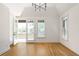 Bright bedroom with hardwood floors and access to a private balcony at 110 Sheridan Ne Dr, Atlanta, GA 30305