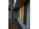 Exterior view of a home at dusk with illuminated window and dark shutters at 1959 Grand Prix Ne Dr, Atlanta, GA 30345