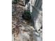 Exterior view of a house with a brick wall, fallen leaves, and a pressure washer at 1959 Grand Prix Ne Dr, Atlanta, GA 30345