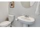 Clean and modern bathroom with pedestal sink and toilet at 167 Belldown Ct, Mcdonough, GA 30253