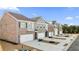 Exterior view of townhomes with brick and siding at 167 Belldown Ct, Mcdonough, GA 30253