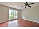 Spacious bedroom with hardwood floors and a large window at 2341 Brenda Se Dr, Smyrna, GA 30080
