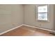 Simple bedroom with wood-look floors and one window at 2341 Brenda Se Dr, Smyrna, GA 30080
