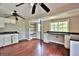 White kitchen cabinets, black countertops, and a door to outside at 2341 Brenda Se Dr, Smyrna, GA 30080
