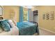 Bedroom with teal bedding and closet at 2711 Honey Locust Ct # 64, Loganville, GA 30052