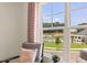 Seating area overlooking a community pool and green space at 2711 Honey Locust Ct # 64, Loganville, GA 30052