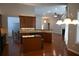 Eat-in kitchen with island, granite countertops, and dark wood cabinets at 2816 Staunton Dr, Duluth, GA 30097