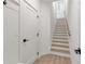 Basement stairs with light wood risers and white walls at 2174 Avion Way # 11, Chamblee, GA 30341