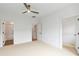 Spacious bedroom with ceiling fan, carpet, and walk-in closet at 2174 Avion Way # 11, Chamblee, GA 30341