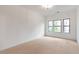 Bright bedroom with neutral carpeting and large windows at 2174 Avion Way # 11, Chamblee, GA 30341