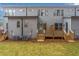 Rear view of home with gray siding and wooden decks at 2174 Avion Way # 11, Chamblee, GA 30341