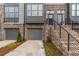 Townhome exterior with brick and gray siding at 2174 Avion Way # 11, Chamblee, GA 30341