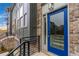 Modern townhome with a blue front door and black metal railing at 2174 Avion Way # 11, Chamblee, GA 30341