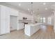Modern white kitchen with stainless steel appliances and a large island at 2174 Avion Way # 11, Chamblee, GA 30341