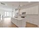 Bright kitchen featuring white cabinets, quartz countertops, and an island at 2174 Avion Way # 11, Chamblee, GA 30341
