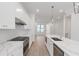 Modern white kitchen with quartz countertops, stainless steel appliances, and open floor plan at 2174 Avion Way # 11, Chamblee, GA 30341