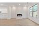 Living area featuring a built-in fireplace and large windows at 2174 Avion Way # 11, Chamblee, GA 30341