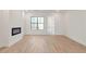 Living room with fireplace and light hardwood floors at 2174 Avion Way # 11, Chamblee, GA 30341