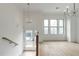 Spacious living room with hardwood floors, large windows, and modern light fixtures at 2174 Avion Way # 11, Chamblee, GA 30341