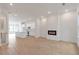 Open floor plan with kitchen and living area, featuring hardwood floors and a fireplace at 2174 Avion Way # 11, Chamblee, GA 30341