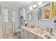 Light and bright bathroom with double vanity and tiled floors at 2390 Sassafrass Ln, Powder Springs, GA 30127