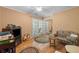 Charming bedroom with French doors to the patio and a comfy sofa at 2390 Sassafrass Ln, Powder Springs, GA 30127