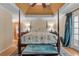 Spacious main bedroom with high ceilings and a ceiling fan at 2390 Sassafrass Ln, Powder Springs, GA 30127