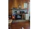 Stone fireplace with wood mantel and built-in shelving at 3321 S Norcross Tucker Rd, Tucker, GA 30084